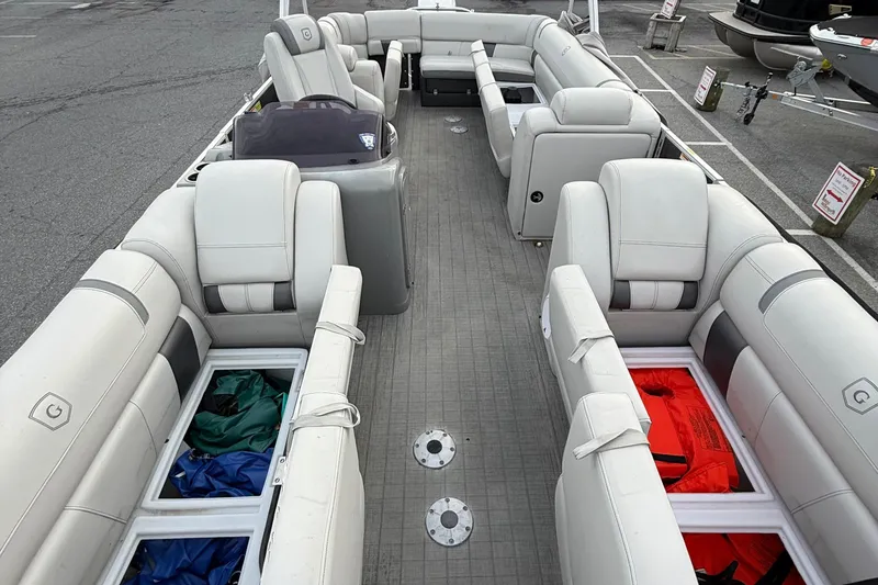 Slide: The Image of 2020 Godfrey AquaPatio 255 UL pontoon boat with spacious seating and storage compartments. - 14