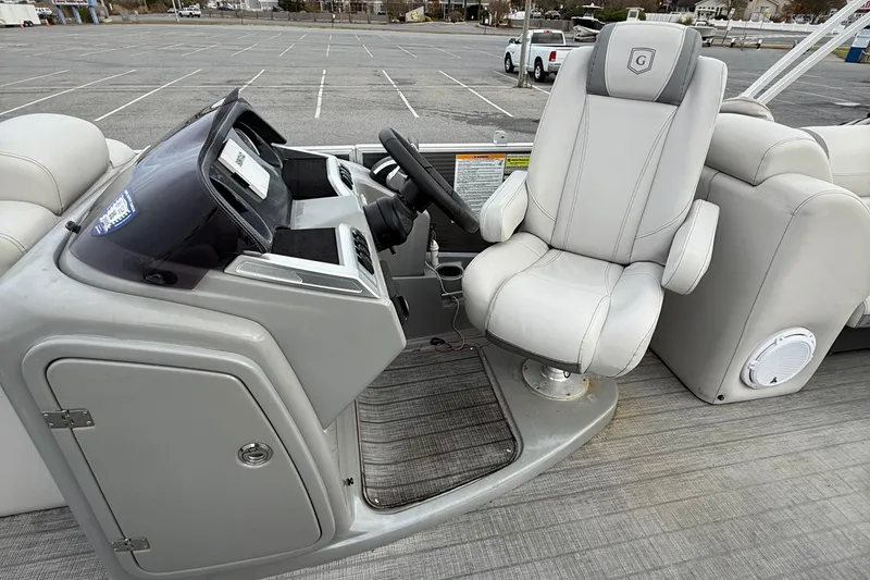 Slide: The Image of Captain's chair and helm of 2020 Godfrey AquaPatio 255 UL pontoon boat. - 15