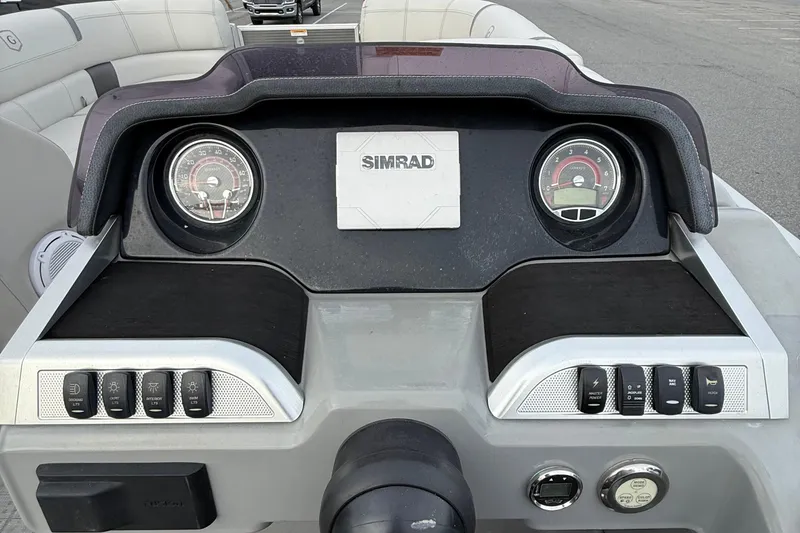 Slide: The Image of Dashboard of 2020 Godfrey AquaPatio 255 UL boat with Simrad display and controls. - 16