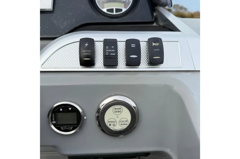 Slide: The Image of Control panel of 2020 Godfrey AquaPatio 255 UL with switches and dials. - 18