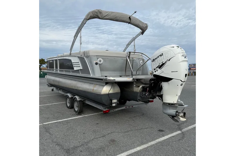 Slide: The Image of 2020 Godfrey AquaPatio 255 UL pontoon boat with Mercury Racing 400R engine on trailer. - 6