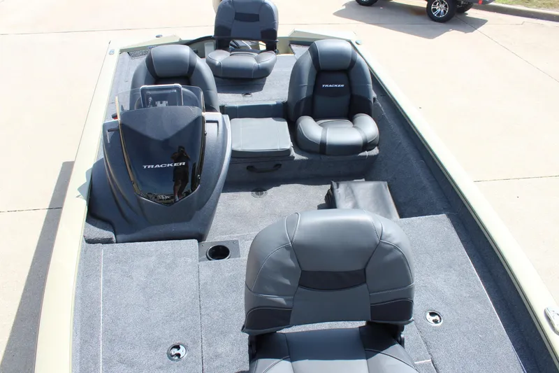 Slide: The Image of 2026 Tracker Pro Team 175 boat interior with gray seating and carpeted flooring. - 16
