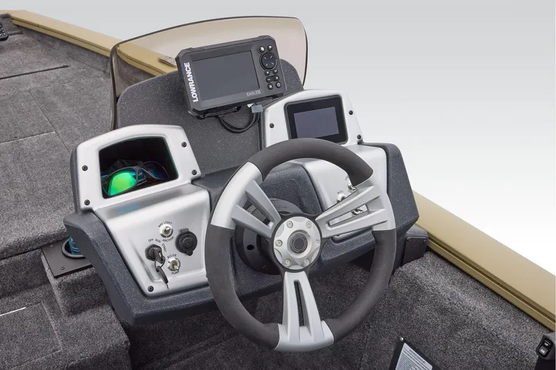 Slide: The Image of Manufacturer Provided Image: 2026 Tracker Pro Team 175 boat dashboard with steering wheel and navigation system. - 46