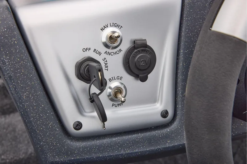 Slide: The Image of Manufacturer Provided Image: Control panel of 2026 Tracker Pro Team 175 boat with switches and 12V outlet. - 47