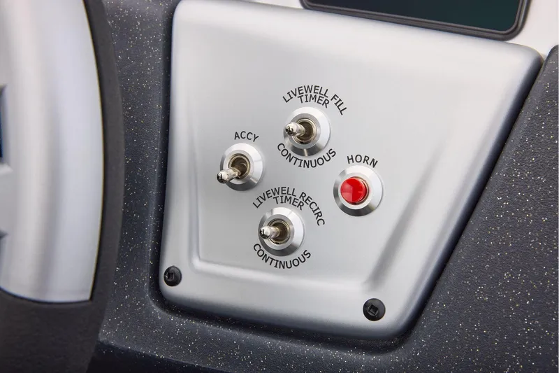 Slide: The Image of Manufacturer Provided Image: Control panel of 2026 Tracker Pro Team 175 boat with switches and horn button. - 49