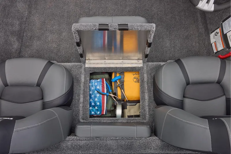 Slide: The Image of Manufacturer Provided Image: 2026 Tracker Pro Team 175 boat interior with storage compartment open, revealing tools and gear. - 52