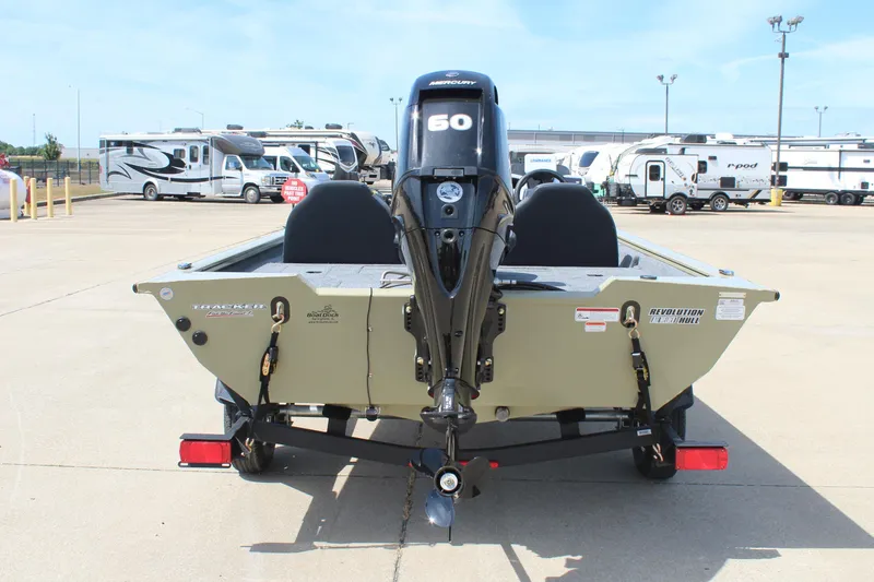 Slide: The Image of 2026 Tracker Pro Team 175 boat with Mercury 60 engine, parked near RVs. - 6