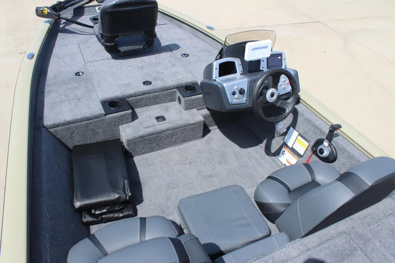 Slide: The Image of 2026 Tracker Pro Team 175 boat interior with steering console and seating. - 7