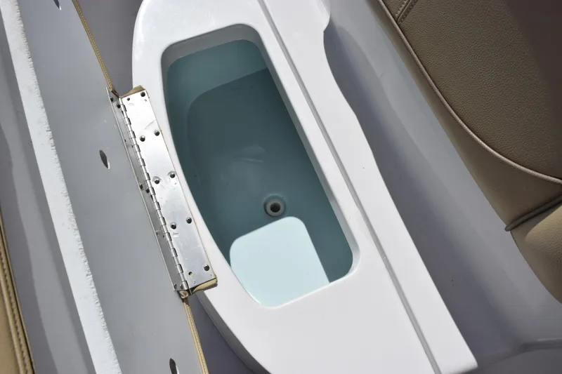 Slide: The Image of Livewell compartment on a 2017 Sportsman Open 232 Center Console boat. - 14