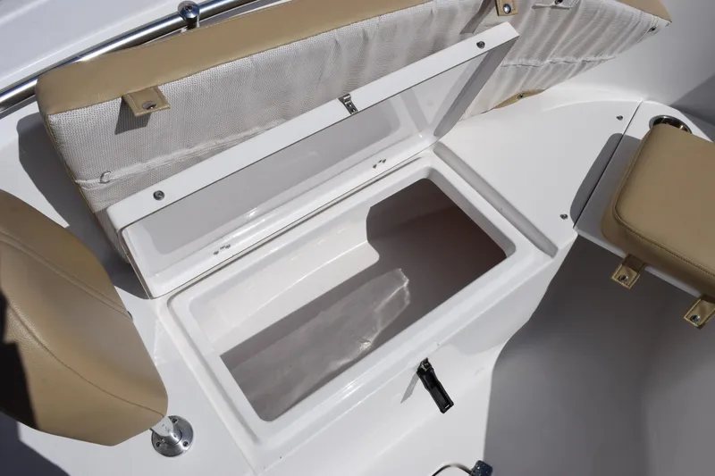 Slide: The Image of Open storage compartment on 2017 Sportsman Open 232 Center Console boat. - 16