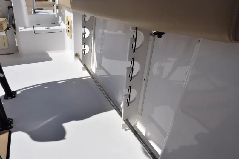 Slide: The Image of 2017 Sportsman Open 232 Center Console interior with rod holders and seating. - 17