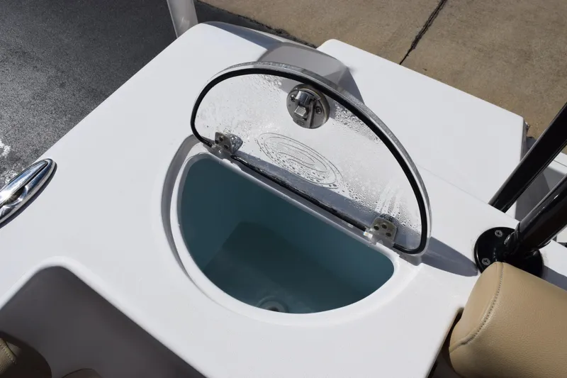 Slide: The Image of Livewell on 2017 Sportsman Open 232 Center Console boat, featuring a clear lid. - 19