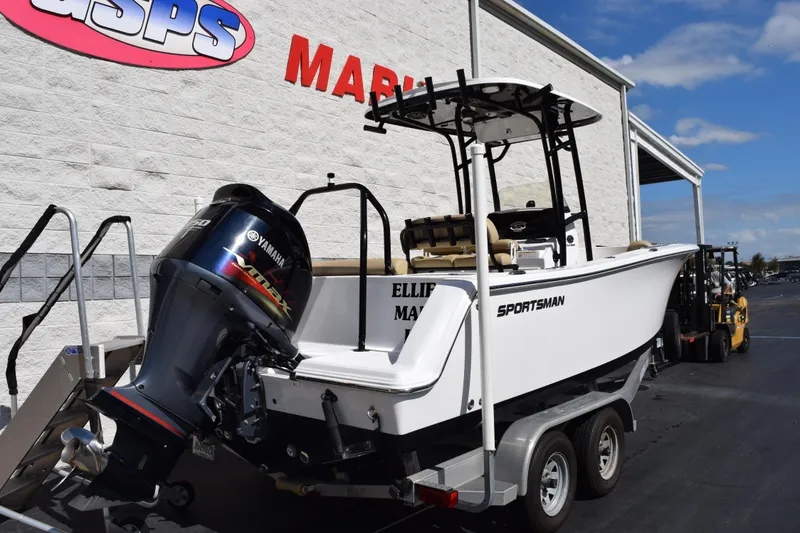 Slide: The Image of 2017 Sportsman Open 232 Center Console boat on trailer, outside dealership. - 4