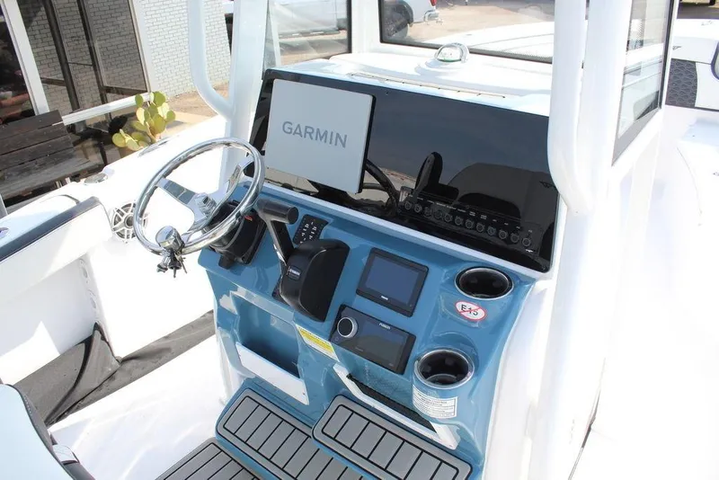 Slide: The Image of 2026 Tidewater 220 CC Adventure boat console with Garmin navigation system. - 13
