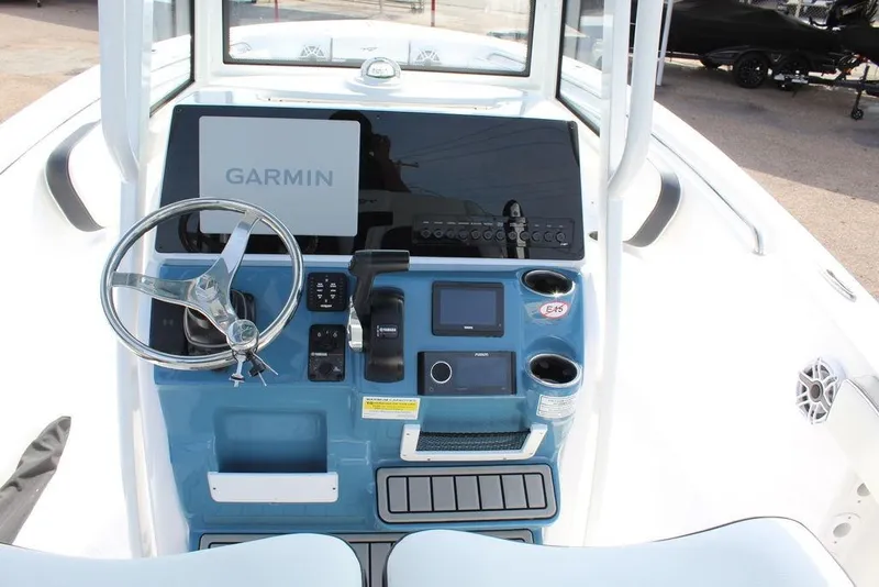 Slide: The Image of 2026 Tidewater 220 CC Adventure boat console with Garmin navigation system. - 14