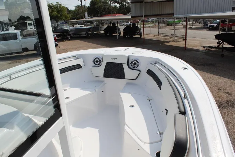 Slide: The Image of 2026 Tidewater 220 CC Adventure boat interior with seating and speakers. - 17