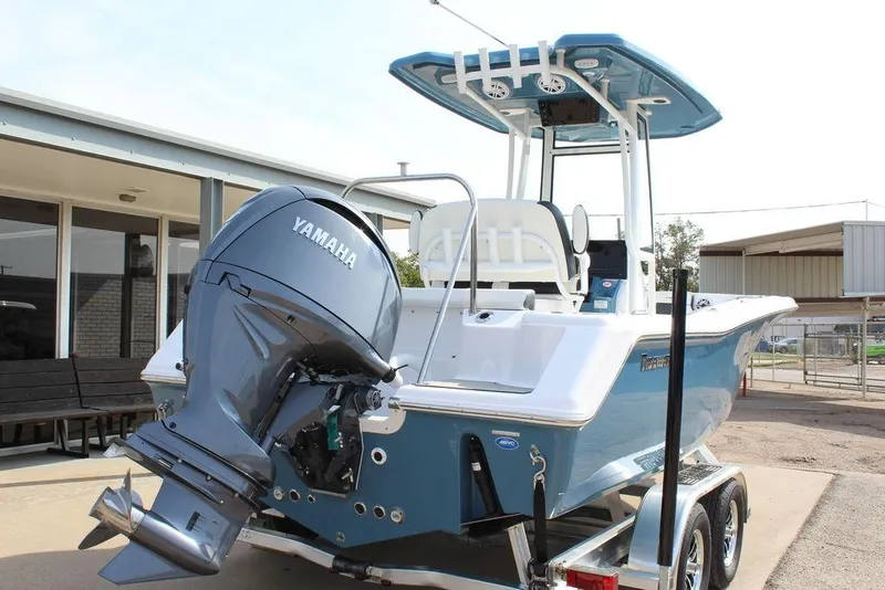 Slide: The Image of 2026 Tidewater 220 CC Adventure boat with Yamaha outboard motor on trailer. - 8