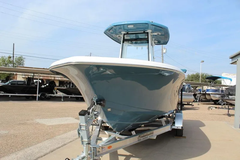 Slide: The Image of 2026 Tidewater 220 CC Adventure boat on trailer, displayed outdoors. - 9