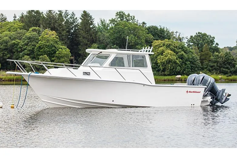 Slide: The Image of Manufacturer Provided Image: 2026 NorthCoast 255 HT boat on calm water, surrounded by lush greenery. - 7