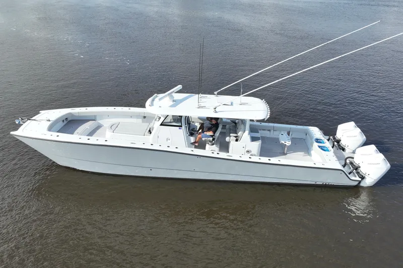 The Image of 2022 Freeman 47 boat on calm water, featuring dual outboard motors. - 0