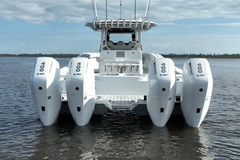 Slide: The Image of 2022 Freeman 47 boat with four powerful 400 V10 engines on calm water. - 10