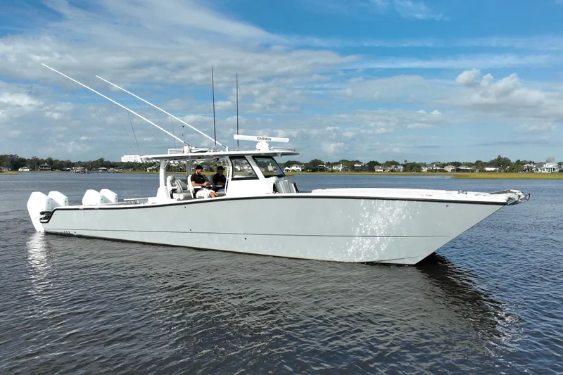 Slide: The Image of 2022 Freeman 47 boat on calm water under a blue sky. - 14
