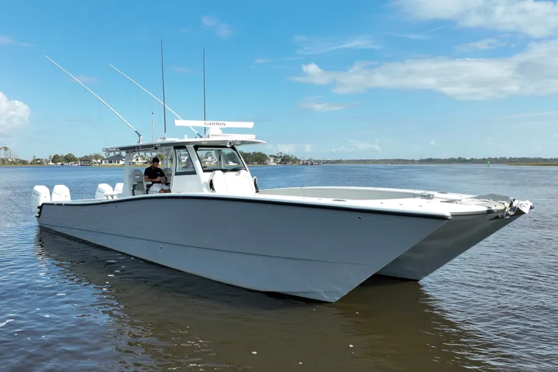 Slide: The Image of 2022 Freeman 47 boat on calm water under blue sky. - 15