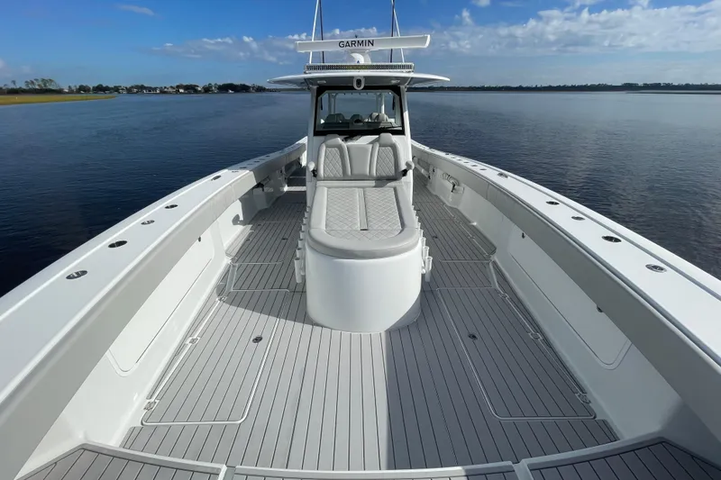 Slide: The Image of 2022 Freeman 47 boat on calm water, featuring spacious deck and modern design. - 22