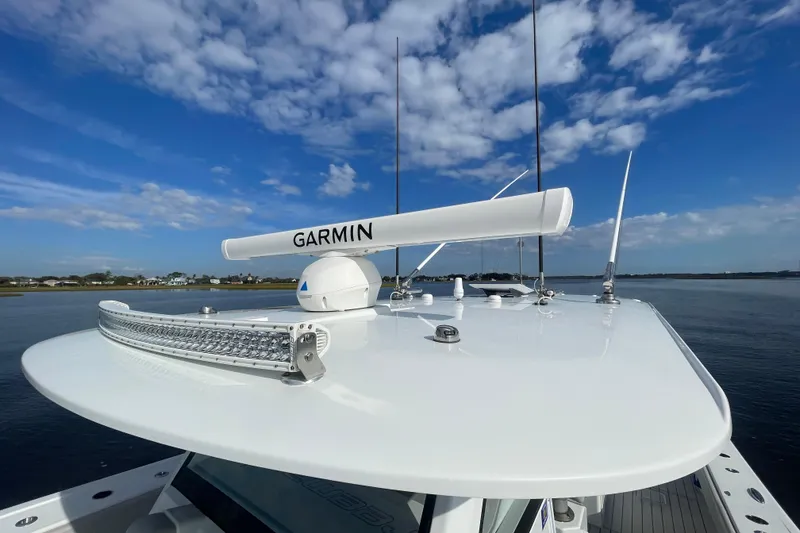 Slide: The Image of Freeman 47 boat with Garmin radar, 2022 model, under a clear blue sky. - 27