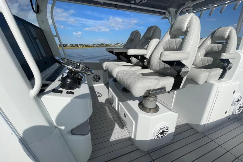 Slide: The Image of Luxurious interior of 2022 Freeman 47 boat with plush seating and modern steering console. - 31