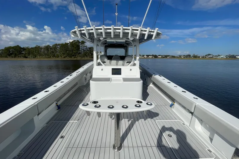 Slide: The Image of 2022 Freeman 47 boat on calm water, featuring spacious deck and modern design. - 38