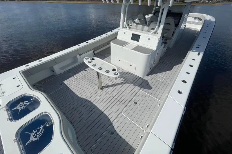 Slide: The Image of 2022 Freeman 47 boat with spacious deck and modern amenities on calm water. - 39