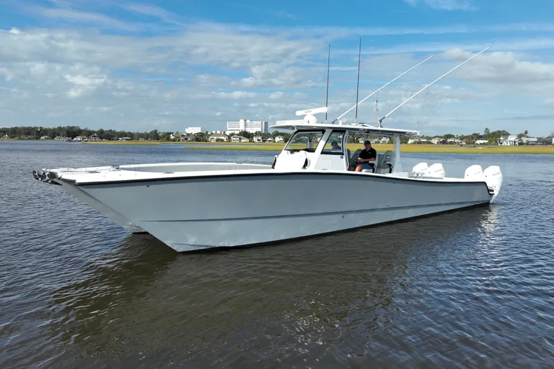 Slide: The Image of 2022 Freeman 47 boat on calm water under a partly cloudy sky. - 4