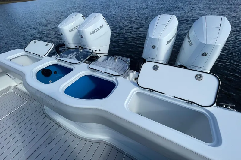Slide: The Image of 2022 Freeman 47 boat with Mercury engines and open storage compartments on deck. - 42