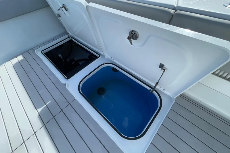Slide: The Image of Open storage compartments on 2022 Freeman 47 boat deck. - 47