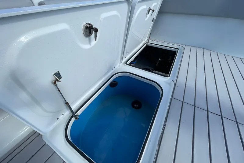 Slide: The Image of Open storage compartments on a 2022 Freeman 47 boat deck. - 48