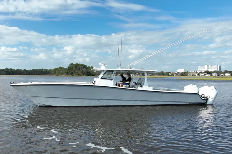 Slide: The Image of 2022 Freeman 47 boat on calm water under a blue sky. - 5