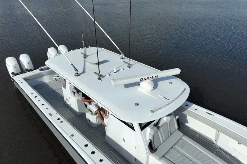 Slide: The Image of 2022 Freeman 47 boat with Garmin equipment on calm water. - 53