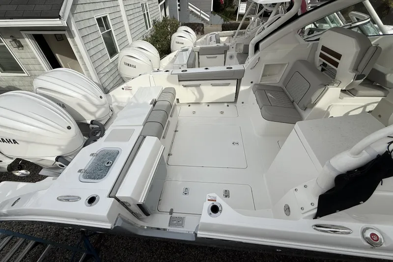 Slide: The Image of 2026 Pursuit DC 306 Dual Console boat with Yamaha engines, spacious seating, and modern design. - 2