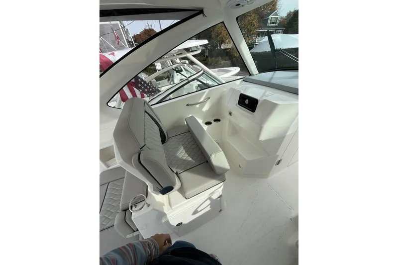 Slide: The Image of 2026 Pursuit DC 306 Dual Console interior with sleek seating and modern design. - 6