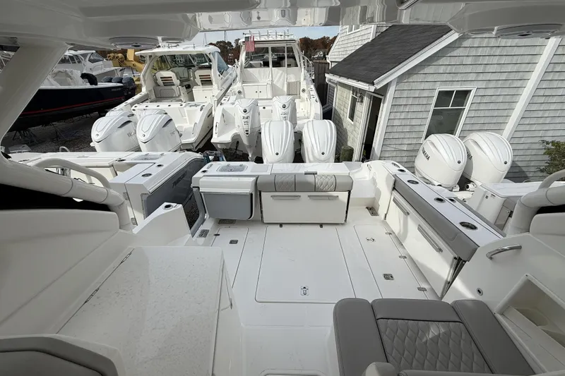 Slide: The Image of 2026 Pursuit DC 306 Dual Console boat interior with multiple outboard engines. - 8