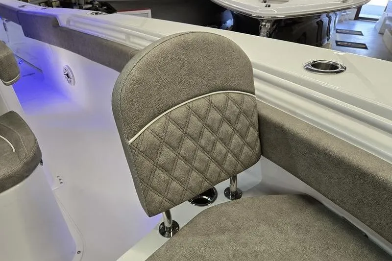 Slide: The Image of 2026 Sea Hunt Ultra 285 SE boat interior with cushioned seating and elegant design. - 13