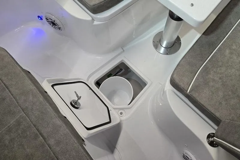 Slide: The Image of Interior of 2026 Sea Hunt Ultra 285 SE boat with seating and storage compartments. - 23