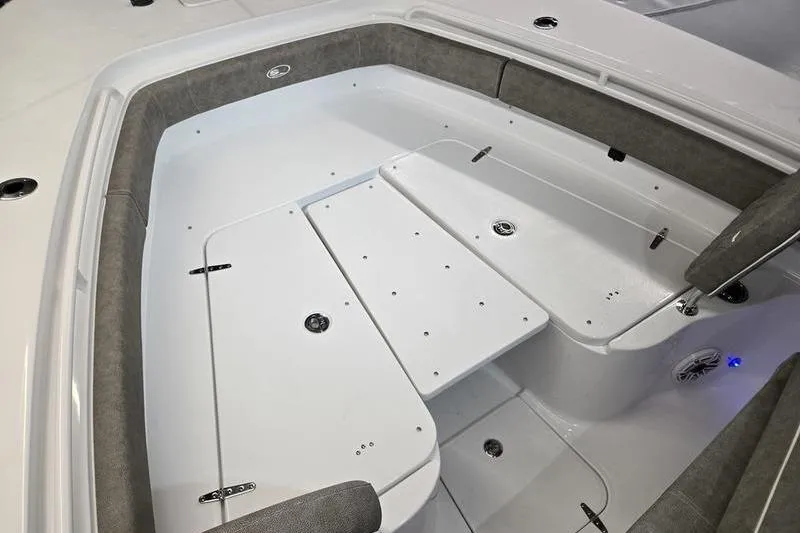 Slide: The Image of Interior view of 2026 Sea Hunt Ultra 285 SE boat, featuring spacious seating and storage. - 24