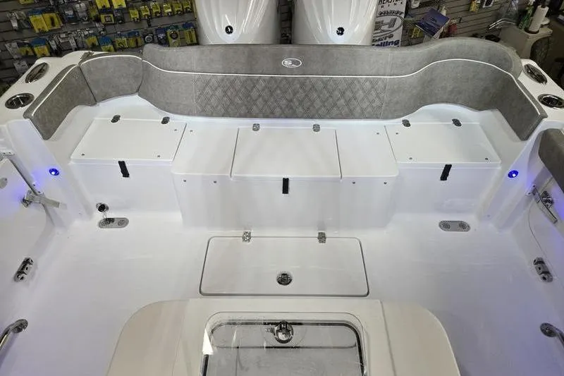 Slide: The Image of 2026 Sea Hunt Ultra 285 SE boat interior with seating and storage compartments. - 26