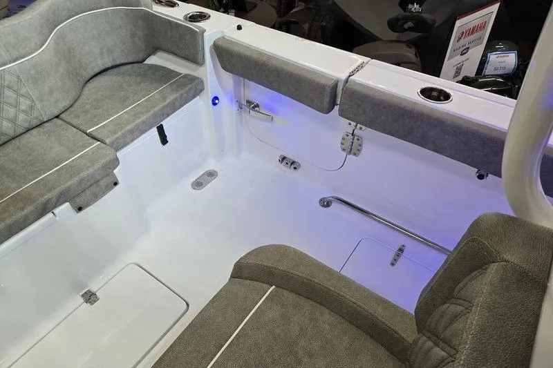 Slide: The Image of 2026 Sea Hunt Ultra 285 SE boat interior with gray seating and blue LED lighting. - 4