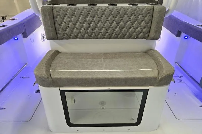 Slide: The Image of 2026 Sea Hunt Ultra 285 SE boat seating with storage and ambient lighting. - 6
