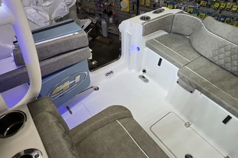 Slide: The Image of Interior of 2026 Sea Hunt Ultra 285 SE boat with gray seating and cup holders. - 7