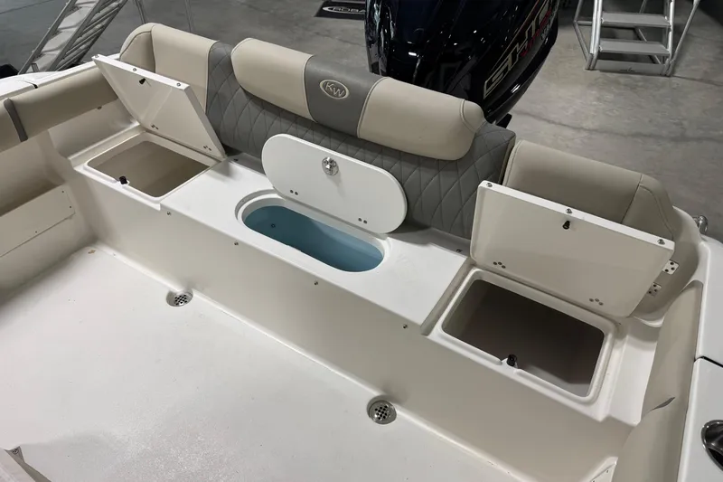 Slide: The Image of 2026 Key West 239 FS boat interior with storage compartments and seating. - 18