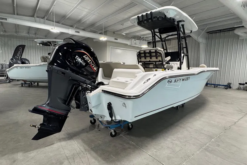 Slide: The Image of 2026 Key West 239 FS boat with outboard motor in a showroom. - 3